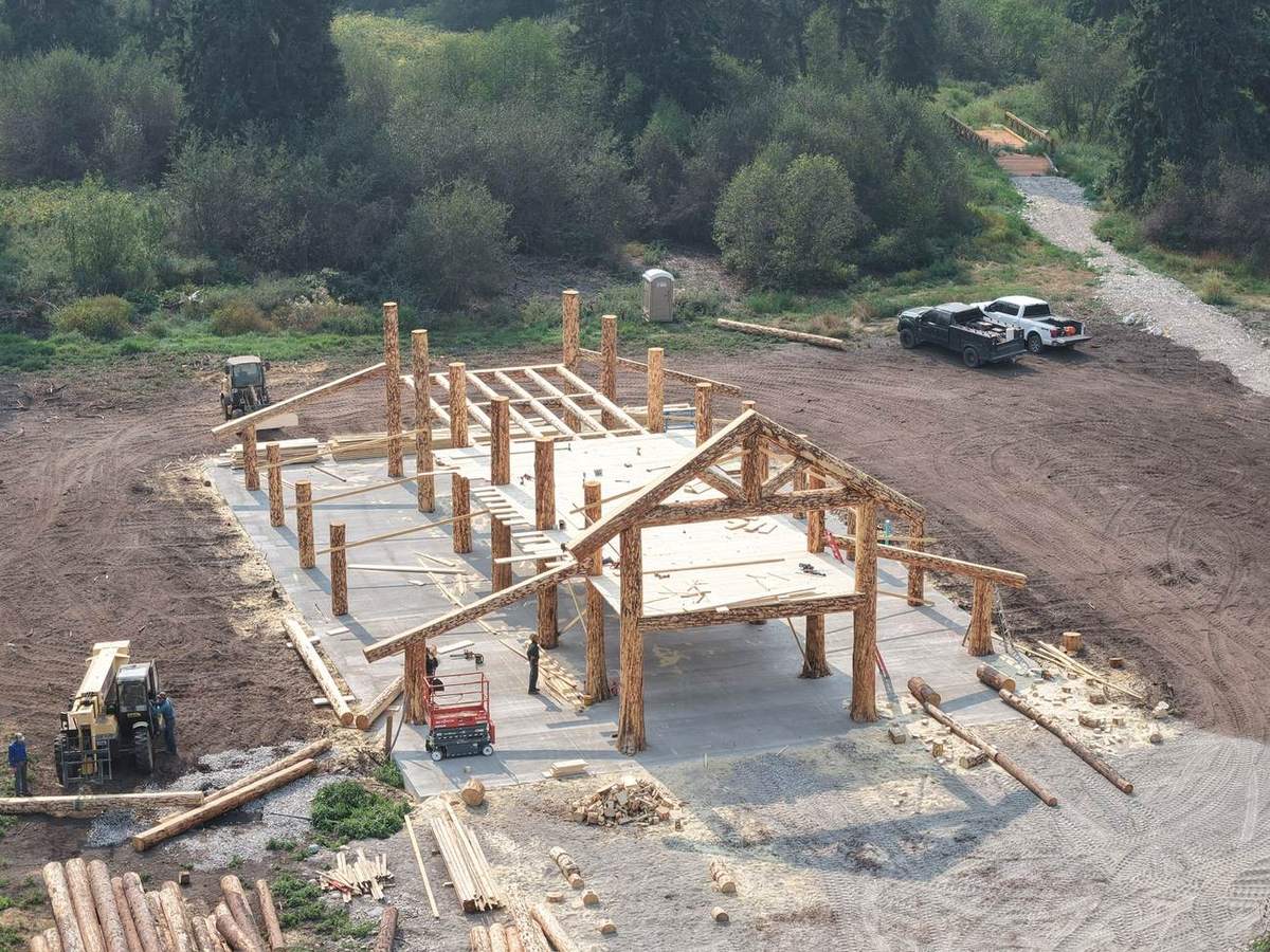 Log posts set on the poured slab, seen from the air