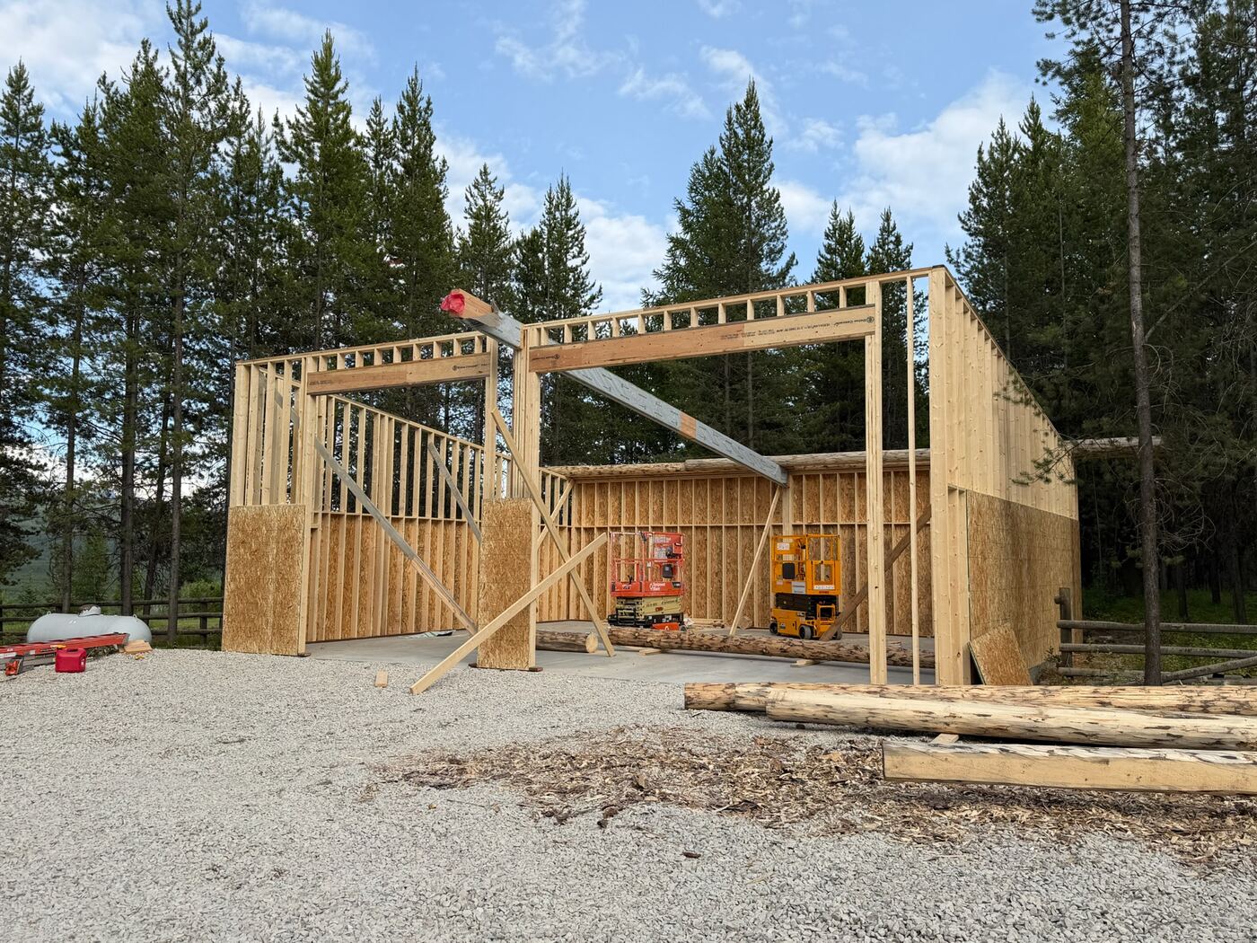 The garage frame standing with both bay openings clear